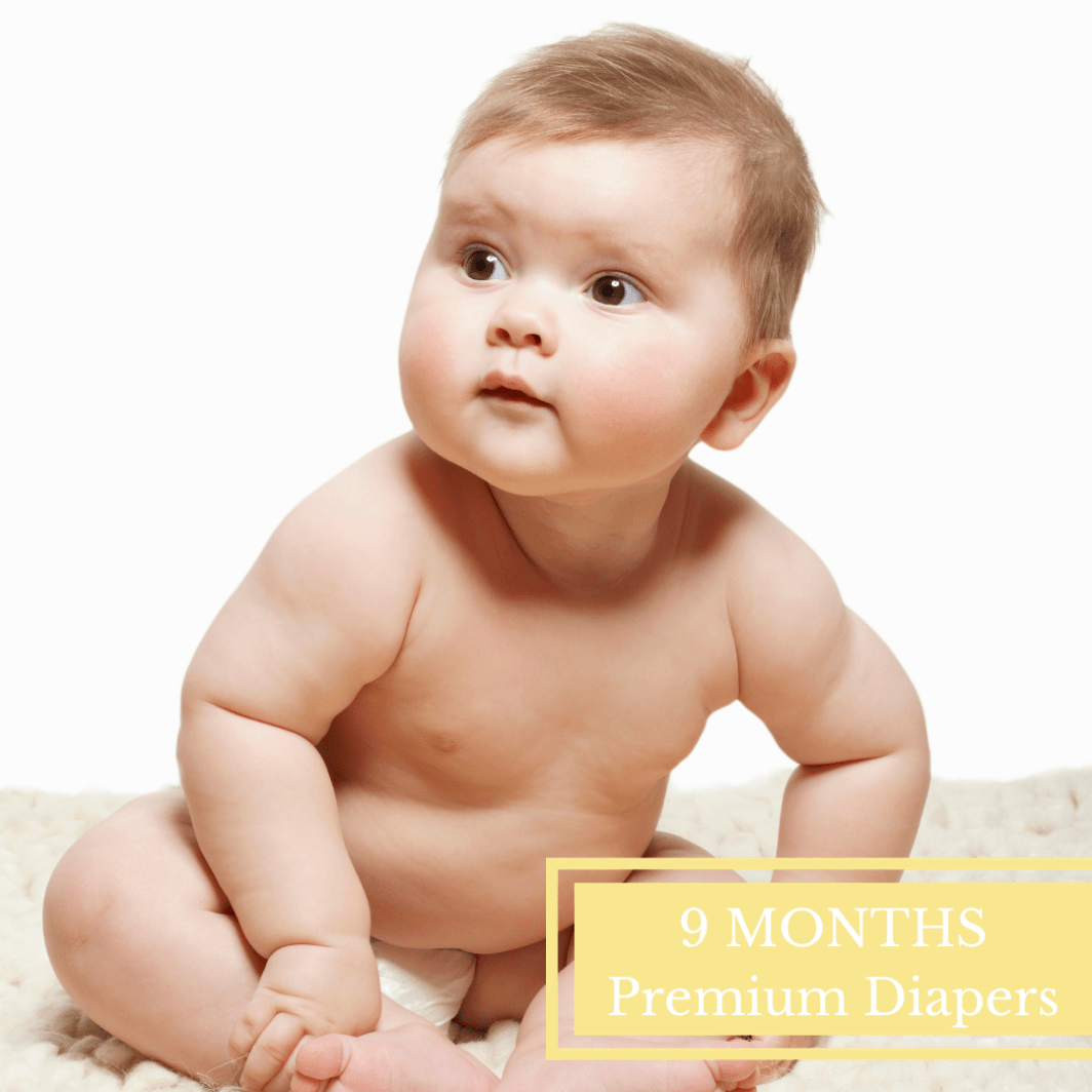 baby in tshirt and diapers laying on back used to advertise our 9 month premium diapers for baby
