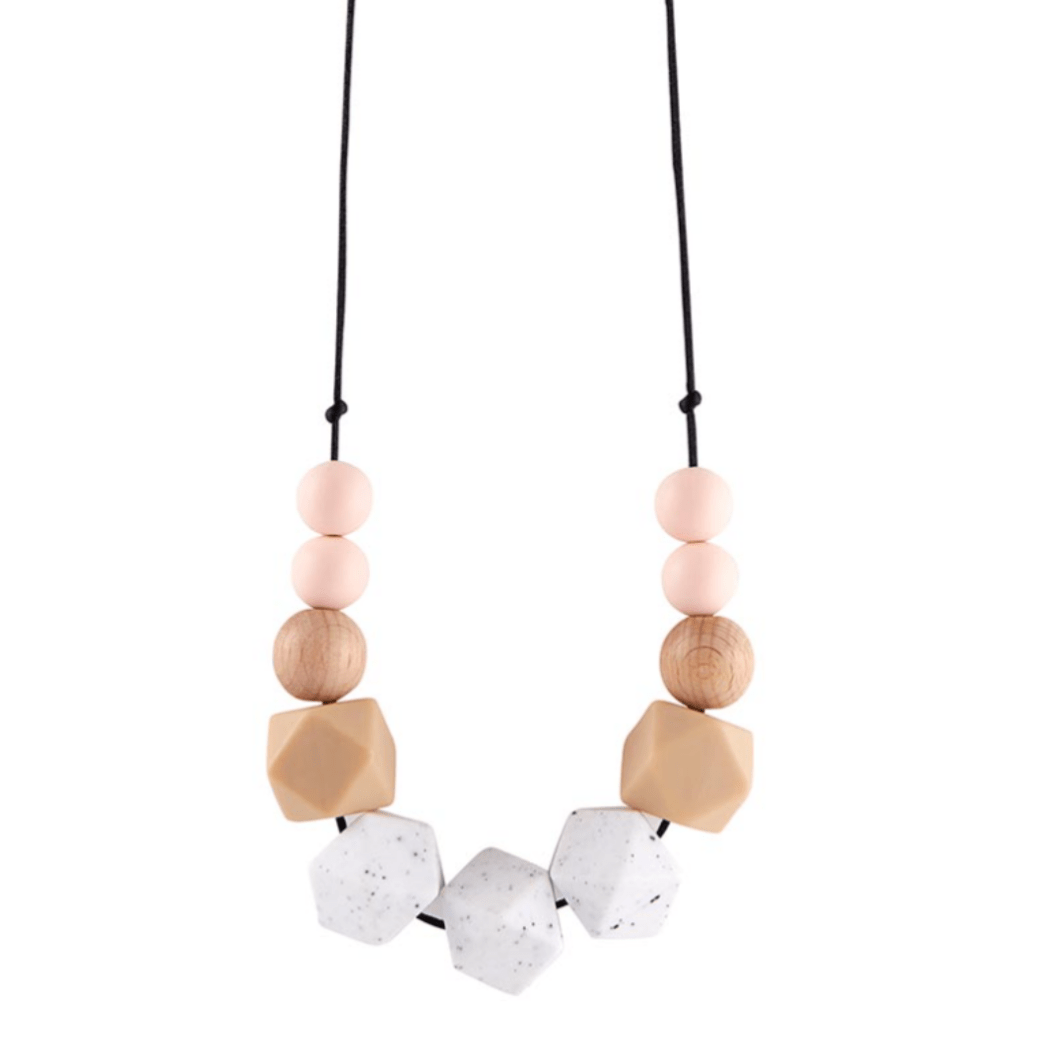 Blush Silicone Necklace This modern statement silicone teething necklace is for the fun loving mom! The necklace is made with soft BPA-free silicone beads that are perfect for your teething little one.