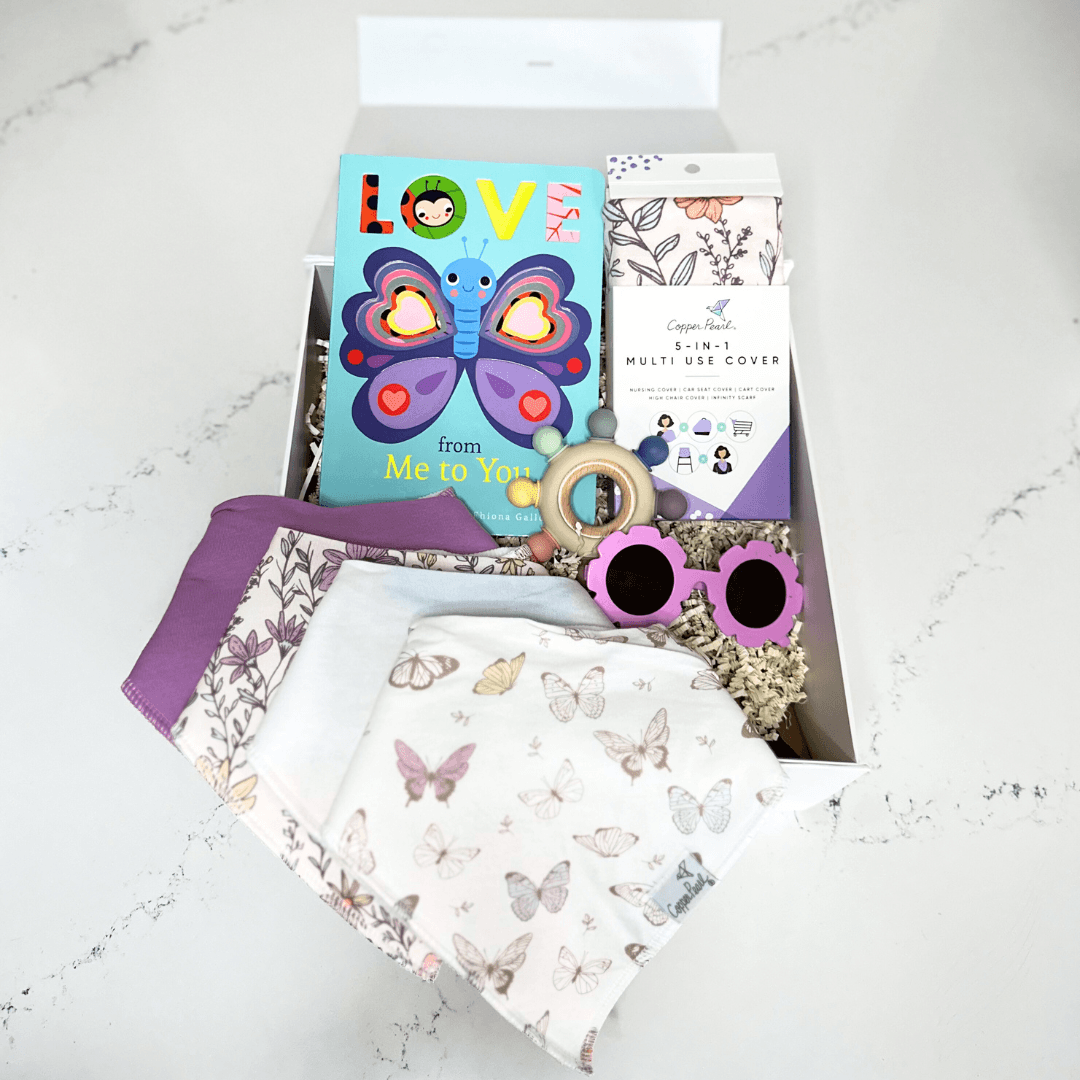Butterfly Love Baby Gift Basket - Baby Showers By Mail butterfly love gift basket with love from me to you board book, copper pearl bandana bibs with different patterns, copper pearl mulit use cover, flower sunglasses for baby and a rainbow wood teether