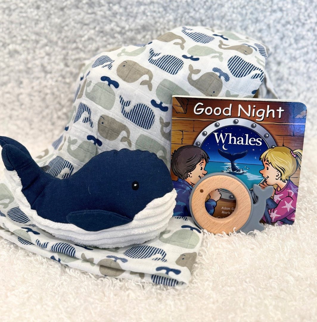 Good night whale baby gift basket with a whale swaddle theme blanket, whale stuffy, whale teether and good night whale board book